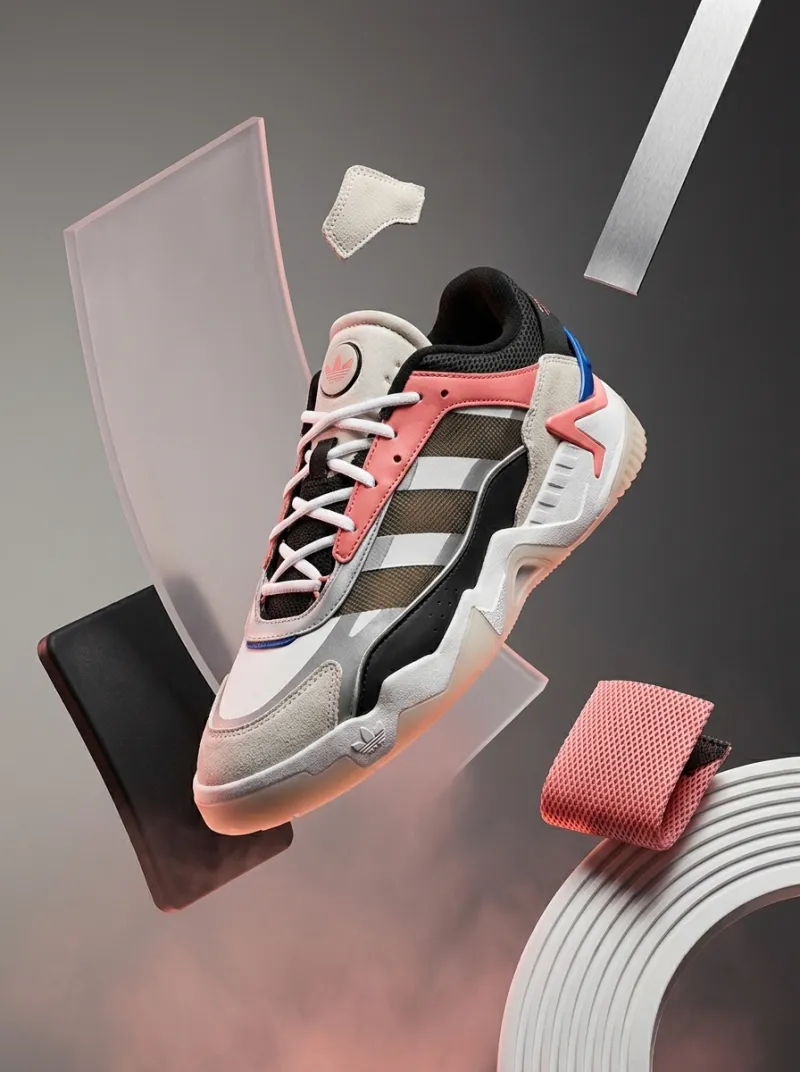Adidas Turnstar sneaker floating among abstract glass and fabric shapes